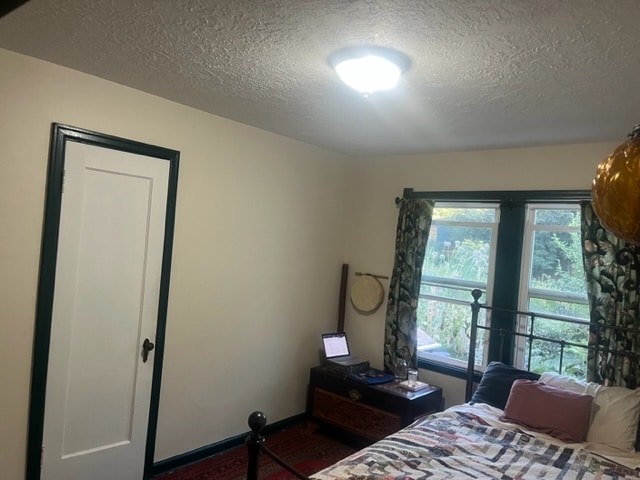 The bedroom looks out on the garden. - 8950 NE Emerson St