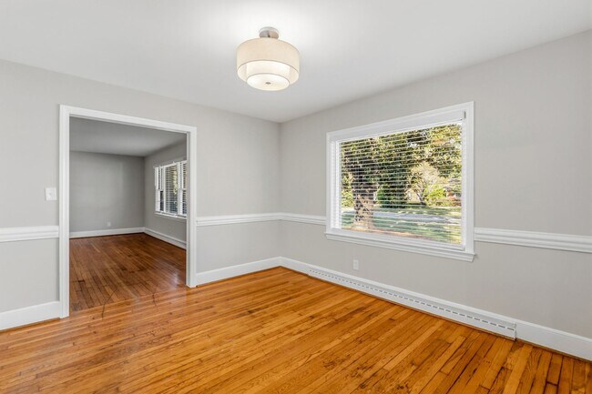 Building Photo - NW - Large Brick Ranch, Updated, Hardwoods, LR, DR, Den, Two Decorative Fire Places, Fenced, Stor...