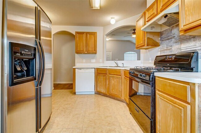 Building Photo - This one-story, three-bedroom, two bath ho...