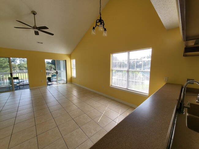 Living/Dining area with new remote control ceiling fan - 4910 Windsor Green Way