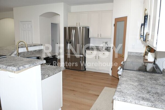 Building Photo - 3 Bedroom + Den Home with Pool & Putting Green – Pool Service Included!