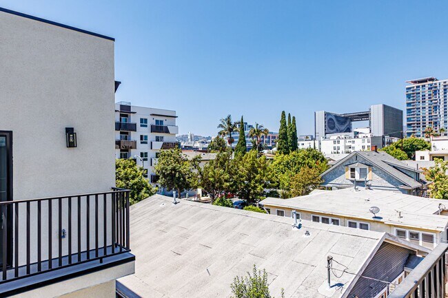 Building Photo - Modern 4-Bedroom Townhome-Style Living in ...
