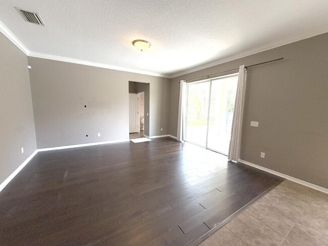 Building Photo - Spacious 5-Bedroom Pool Home with Putting ...