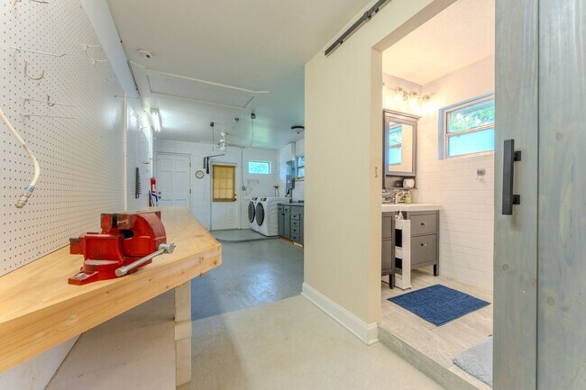 Building Photo - Lake Jessamine Luxury: Solar-Powered Waterfront Retreat on 1.14 Acres with Dock & Boathouse