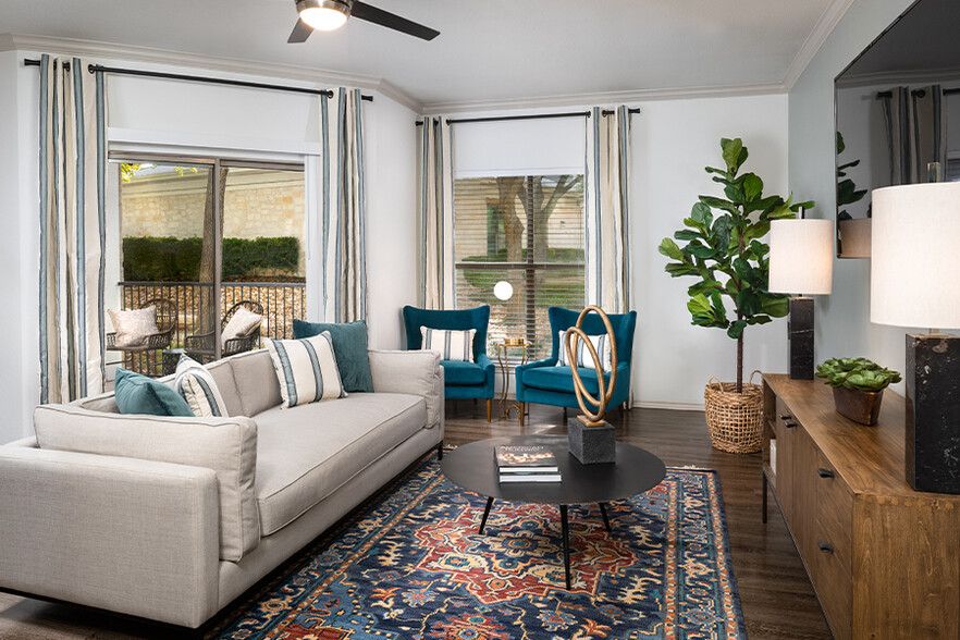 Upgraded homes feature crown molding and luxury vinyl plank flooring in select living spaces - The Madison Apartments