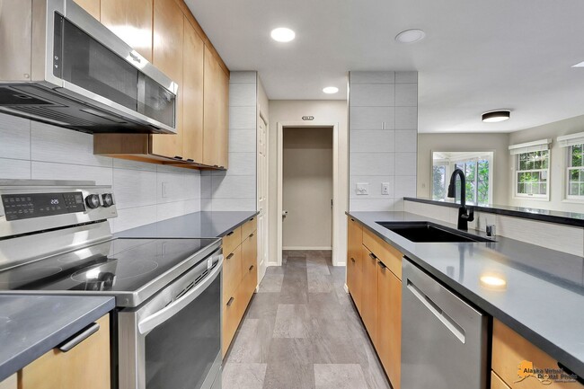 Building Photo - Spacious and bright condo located in a quiet area that boasts the perfect combination of style an...