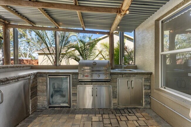 Building Photo - A vibrant 2-bedroom, 2-bathroom tropical retreat designed for both high-energy entertaining and l...