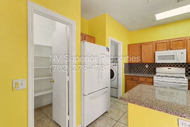 Building Photo - NW!! 4 Bedrooms!!! All Tile and Pergo flooring T/O!! NO Carpet!!! Low Maintenance Desert landscap...