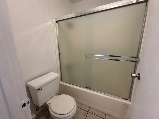 Building Photo - Two Bedroom Triplex with One Bathroom and ...