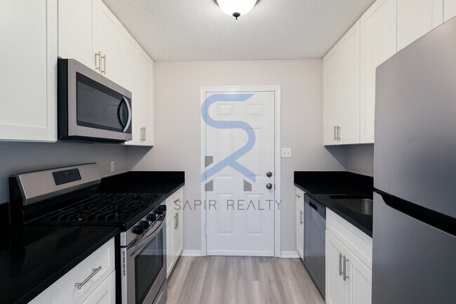 Building Photo - Move in before November 30th and choose your reward: a $250 Amazon Gift Card or a 55 Smart TV!