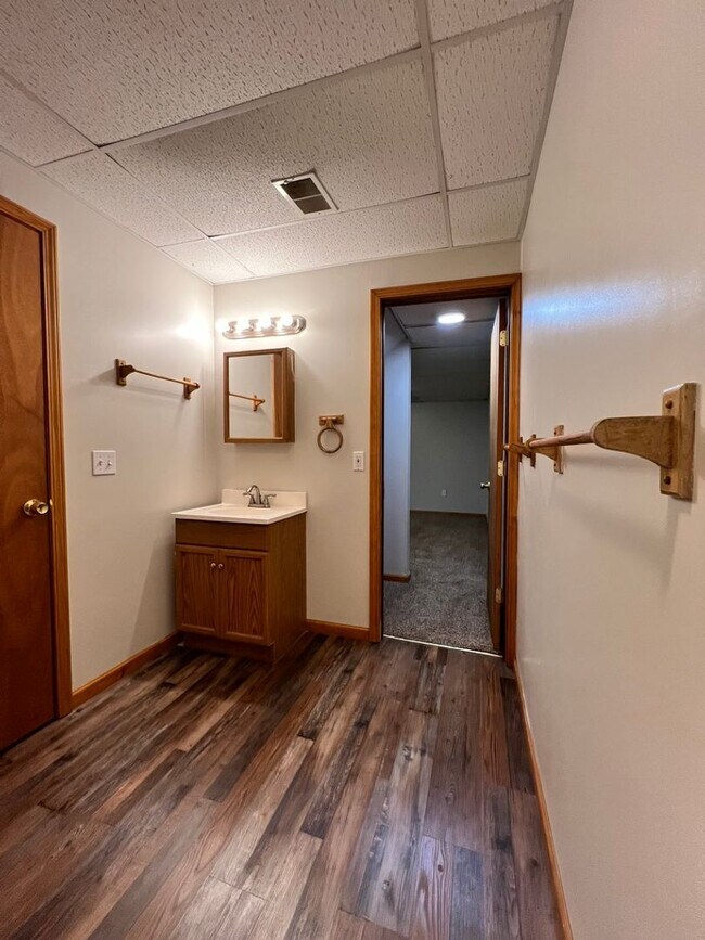 Building Photo - Spacious 3BR Duplex with Finished Basement & 2-Car Garage in Otsego