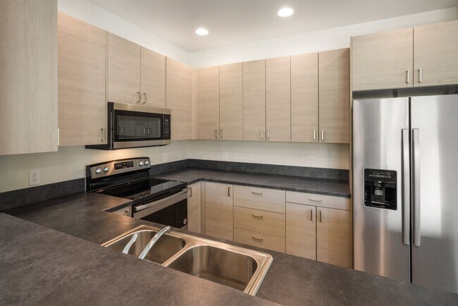 Building Photo - Pet Friendly! Gorgeous 3 Bedroom condo with double stall attached garages with AC.