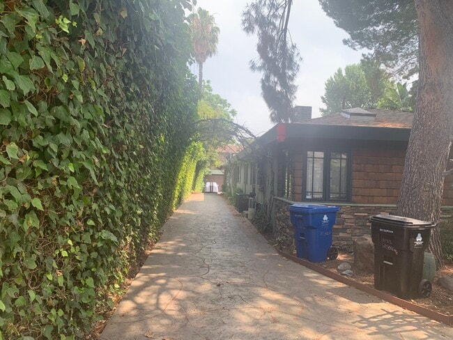 Unit is down this gated driveway - 14715 Greenleaf St