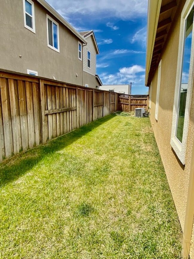 Building Photo - ALMOST NEW, UNIQUE 4 BEDROOM, 3 BATH, 2 CA...