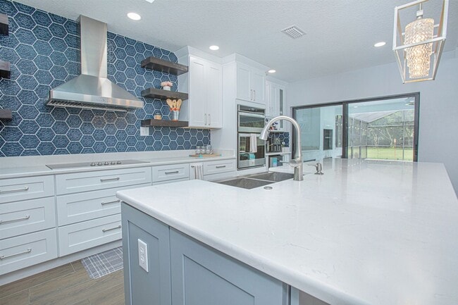 Building Photo - Beautifully Updated 3/2 Pool Home with Large Backyard in Lake Ajay (Gated Community)
