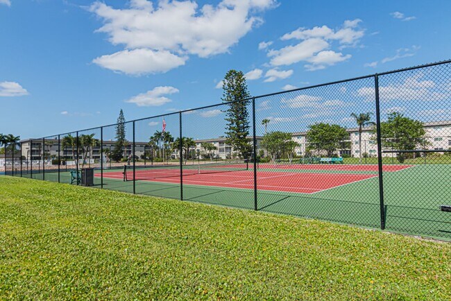 Building Photo - AVAILABLE NOW! Furnished Ground-Floor End Unit | Lake & Pool Views | Minutes to Marco Island & Do...