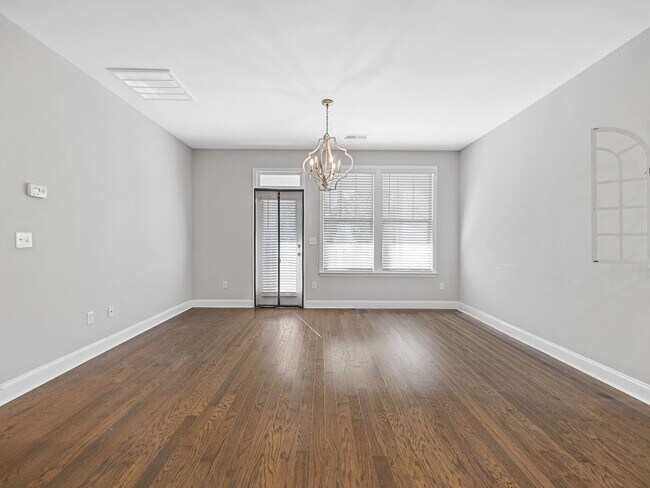 Building Photo - **MOVE IN SPECIAL! 50% off first month's rent!!** Spacious 4BR Townhouse with 2-Car Garage Near D...