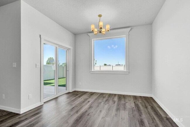 Building Photo - 4 bedroom, 2.5 Bath is a Must See! 1962 SqFt, Beautiful Parks, No Landscaping, and More!