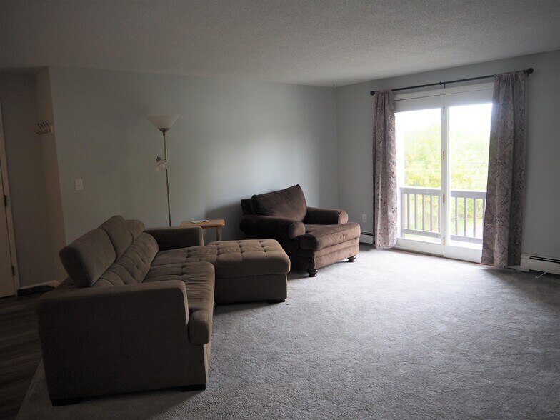 Family room with slider to deck space - 283 Privilege St