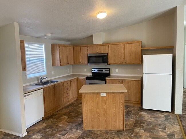Building Photo - 3 bedroom, 2 full baths, carport and shed
