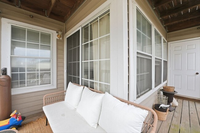 Building Photo - Bathed in natural light, this stunning second level condominium offers an effortless blend of com...