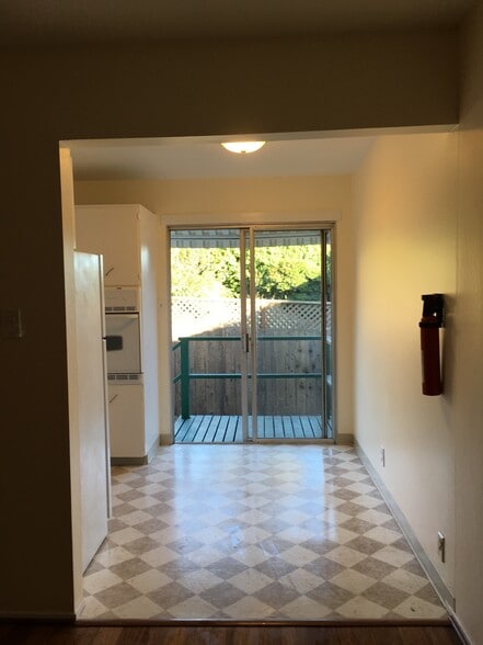 living room towards kitchen and back deck to yard - 5428 Van Fleet Avenue