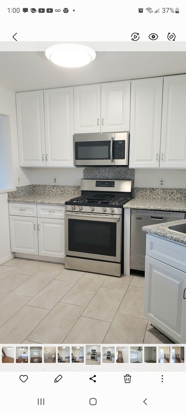 Kitchen with granite countertop and stainless steel appliances - 634 Pioneer Dr