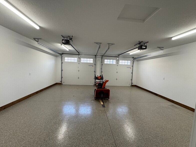 Heated garage with epoxy floors and drains - 11573 Forestview Dr