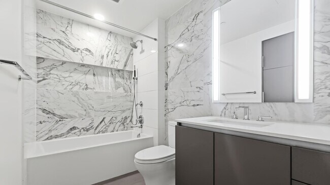 Building Photo - Luxury 1 Bed • 1 Bath at Spire Condominiums
