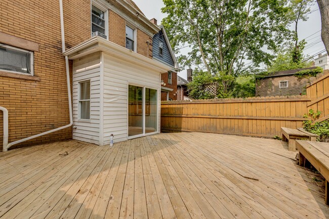 Building Photo - AVAILABLE June 2026 - Beautiful 4 Bedroom, 2 Bath Home w/ Front Porch Swing!