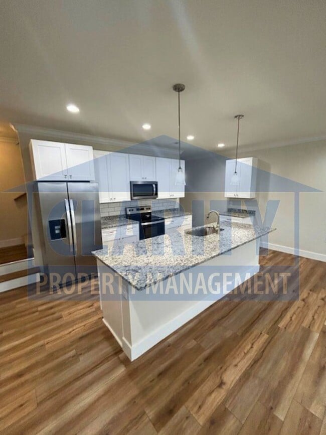 Building Photo - Three bedroom townhome w/ garage!