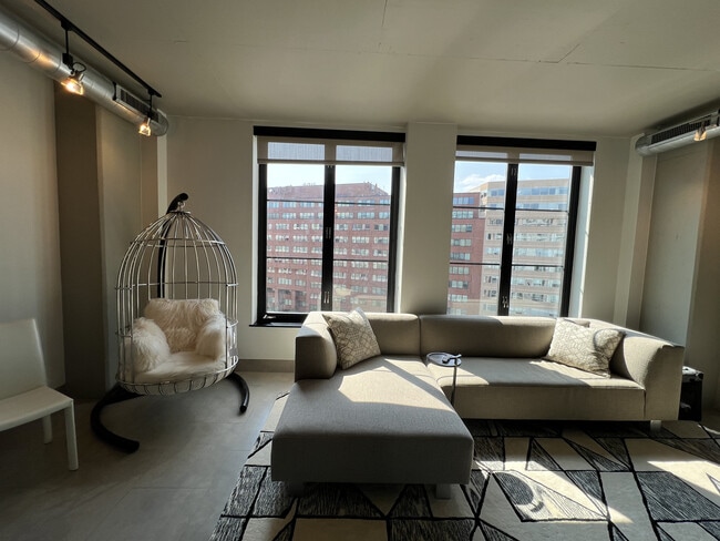 Living room with Michell Gold & Bob William Chair - 1133 14th St NW