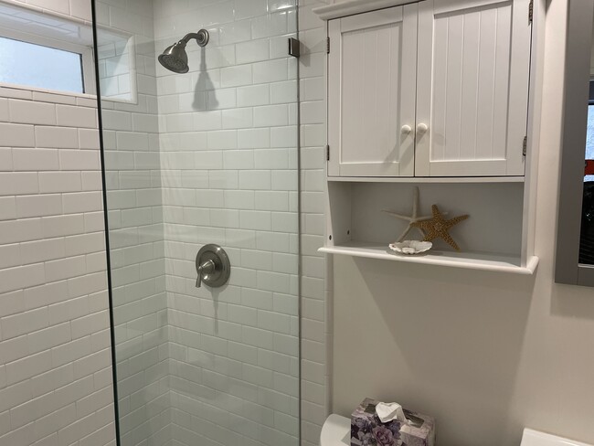 Glass enclosed shower - 202 39th St