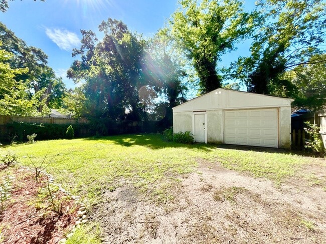 Building Photo - Cozy Home with Private Backyard & Detached...
