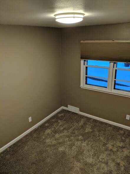 Bedroom Two New window treatments and new carpet - 705 E. 19th Street