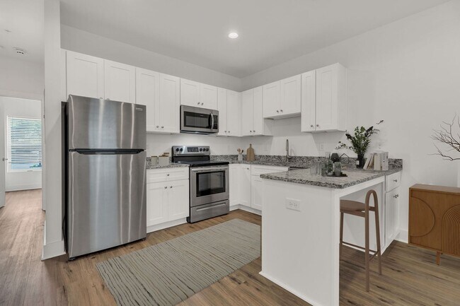 Building Photo - Simple living?  We got you.  $1200/mo water and laundry included in this 1 BR condo.