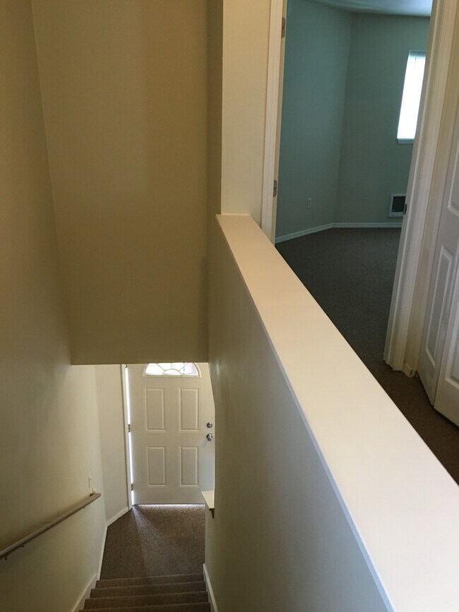 Stairs, washer and dryer in hall on right - 4711 S Puget Sound Ave