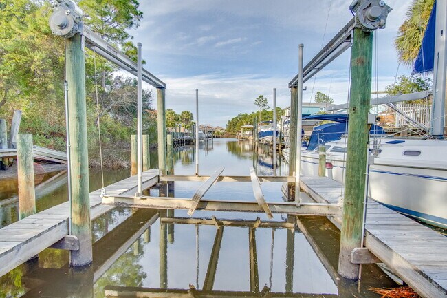 Building Photo - Live the Gulf Breeze Waterfront Life – Dock, Canal Access & Boat Lift!
