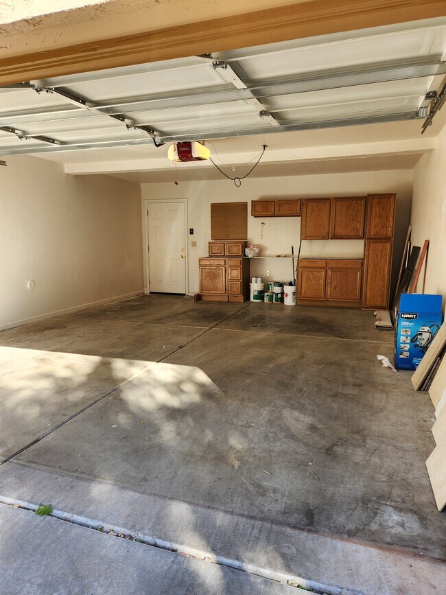 2 car garage with storage. - 5640 E Bell Rd