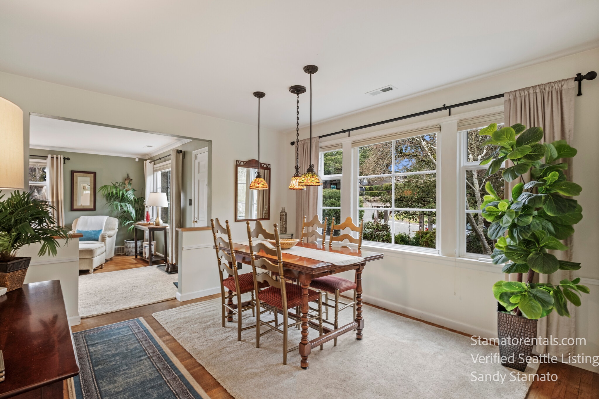 Garden-view dining area for meals, work, or conversation. - 11639 1st Ave NW