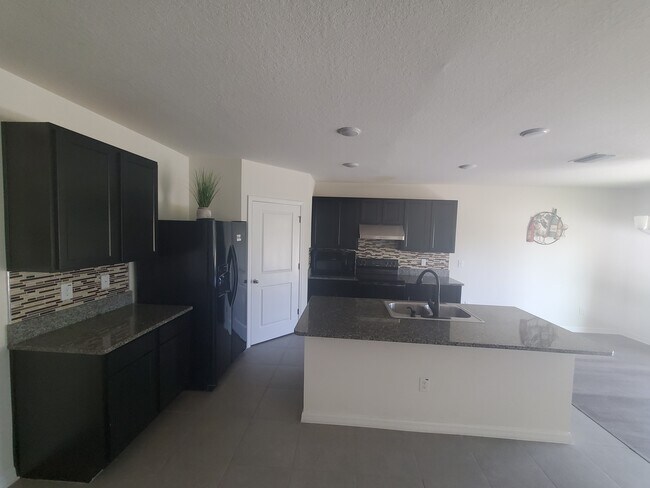 Building Photo - 6776 Wagon Trail St