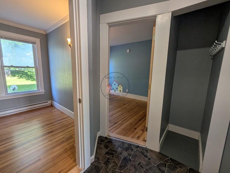 Hallway to bedrooms with small storage closet - 16 Clinton Ave