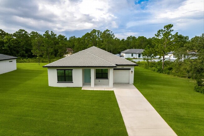 Building Photo - Brand New 4-Bedroom Gem with 2 Full Baths on Large Lot in Lehigh Acres – A Perfect Family Haven!