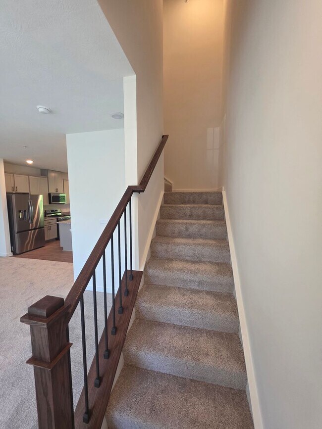 Building Photo - Brand-new townhome with modern finishes, flexible living space, and low-maintenance living.