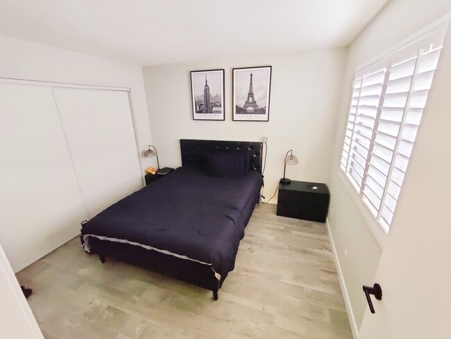 Guest bedroom with wood shutters and large closet space - 12621 Ralston Ave