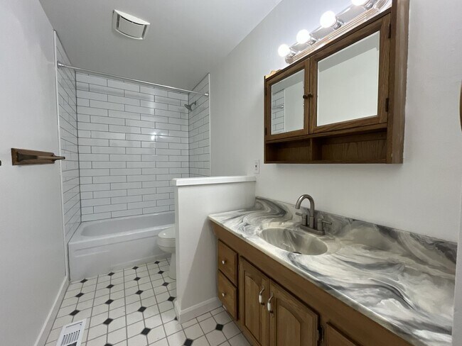 Building Photo - Charming Ranch Home with Sunroom or 4th Bedroom, Two-Car Garage and Fenced Backyard