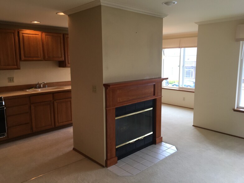 Open concept living room / dining area / kitchen - big windows facing west, lots of light - 610 Glen St