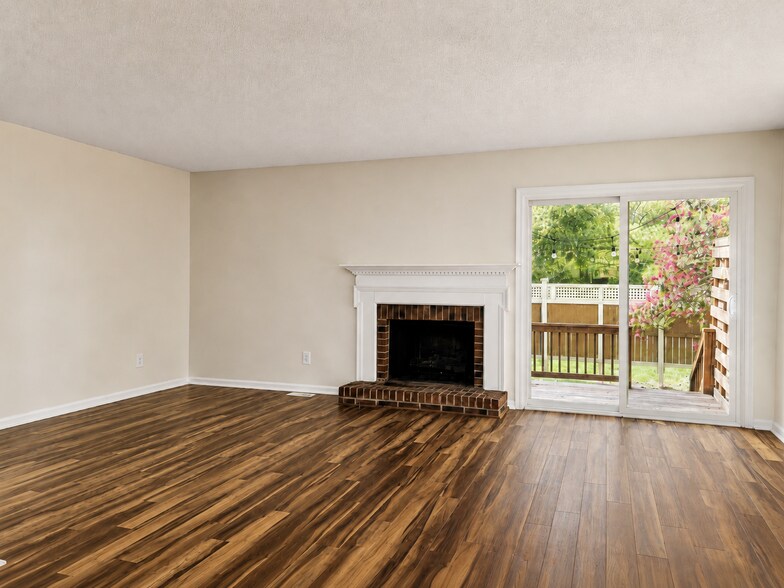 Living room from dining area/kitchen. - 5484 Pine Top Cir