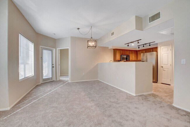 Building Photo - FIRST FLOOR CONDO IN GATED COMMUNITY W/ SINGLE CAR GARAGE