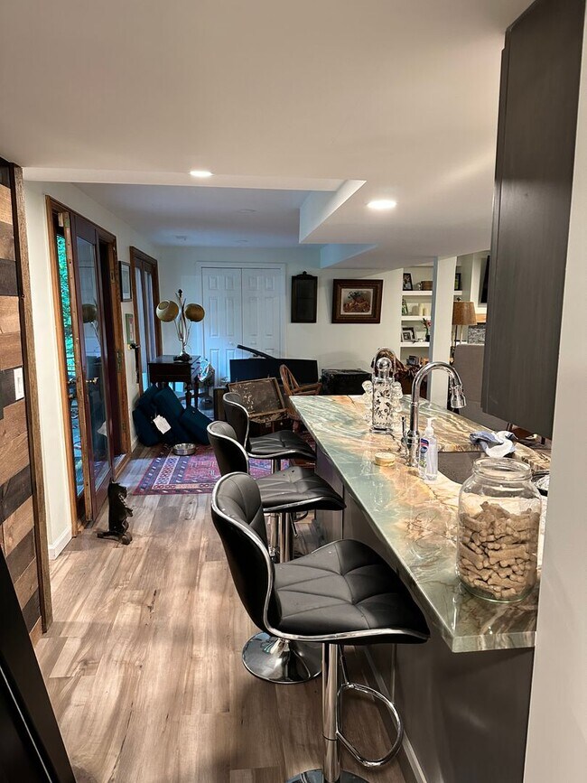 Building Photo - Dream Home in Highland, Michigan: Your Private Oasis on 5 Wooded Acres